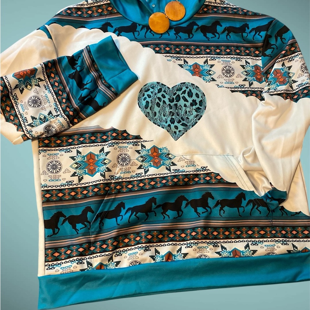 Teal and White Patterned Sweatshirt with Heart Design